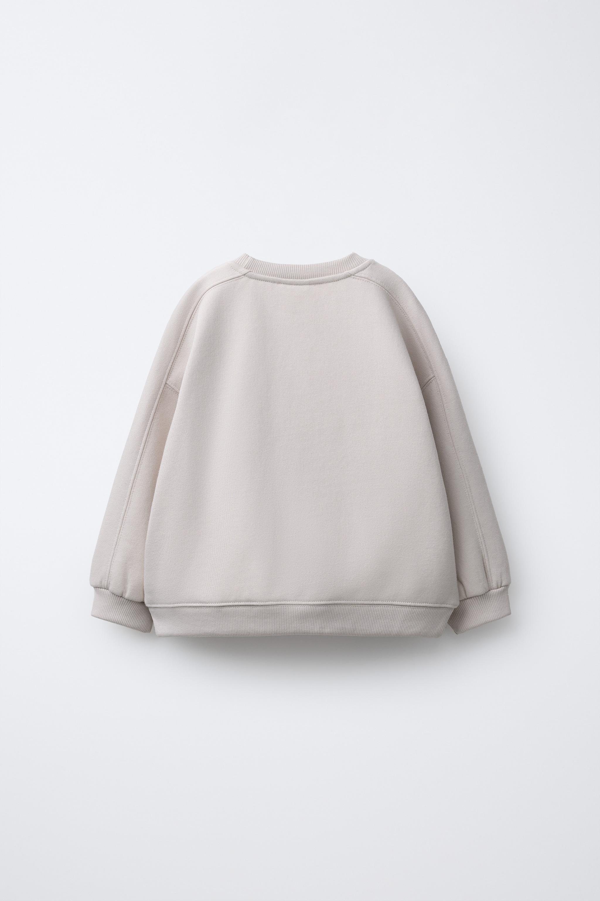 SWEAT AVEC INSCRIPTION EN RELIEF